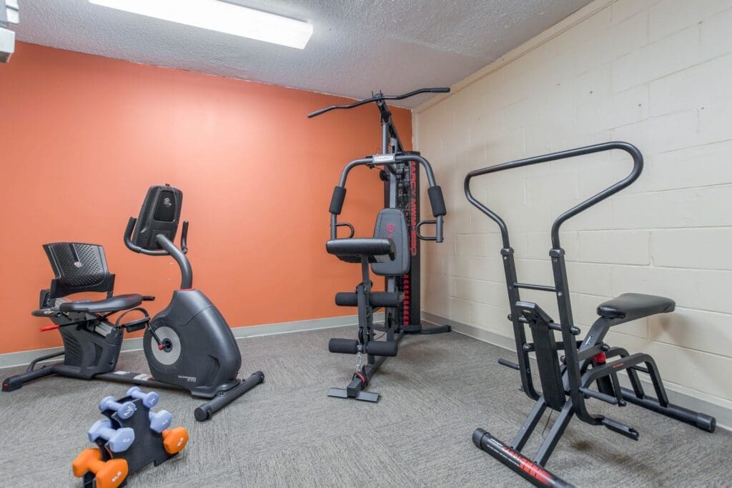 Fitness room with variety of exercise machines and equipment